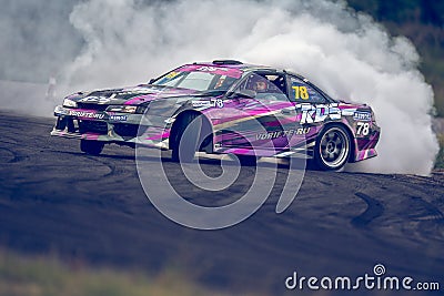 Saint-Petersburg, Russia - August 15, 2018: Powerful race car drifting on speed track Editorial Stock Photo