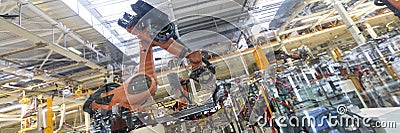 Automated Assembly process of cars by robots. Automotive production line. long format. Wide frame Stock Photo