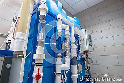 Automated ozone generator for ozonation of pure drinking water in water production factory Stock Photo