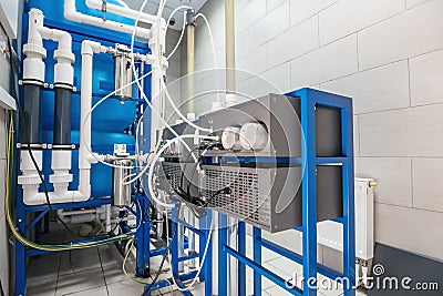 Automated ozone generator for ozonation of pure drinking water in water production factory, close up Stock Photo