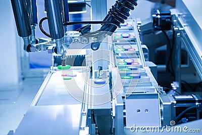 Automated picking robotic in assembly production line Stock Photo