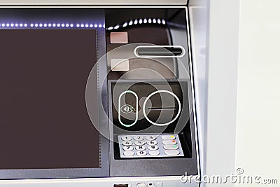 Automated teller machine details, ATM. Cashpoint keypad, NFC contactless wifi system, card reader and receipt printer Stock Photo