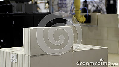Automatic bricklayer robot working for building a wall. Media. Close up of automated machine presented at the robotic Editorial Stock Photo