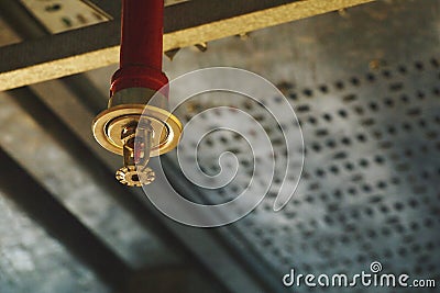 Automatic ceiling Fire Sprinkler in red water pipe System Stock Photo