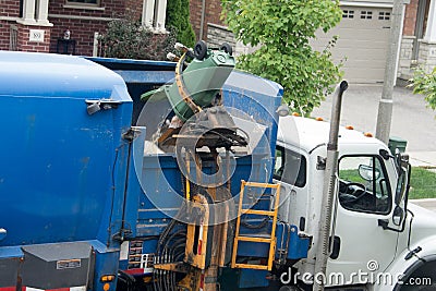 Automatic discharge of food waste into the garbage truck Stock Photo