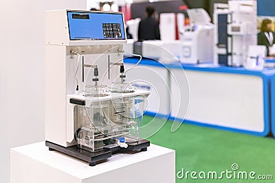 Automatic disintegration tester device or equipment of lab for process check & analysis or research property gelatin capsules or Stock Photo