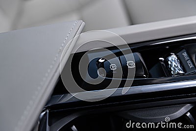 Automatic electric parking hand brake. Modern car Stock Photo