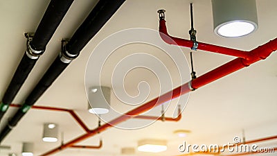 Automatic fire sprinkler safety system and black water cooling supply pipe. Fire Suppression. Fire protection and detector. Fire Stock Photo