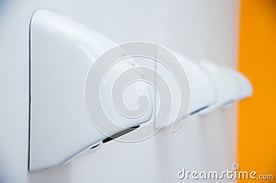 Automatic hand dryers in public toilet Stock Photo