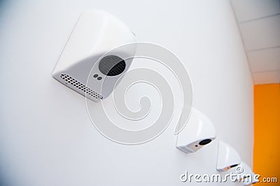 Automatic hand dryers in public toilet Stock Photo