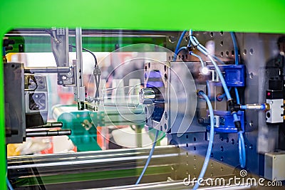 Automatic injection molding machine making plastic cup Stock Photo