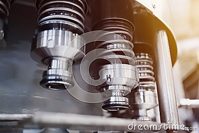 Automatic line for filling beer and water into plastic bottles. Industrial production of beverages. Stock Photo