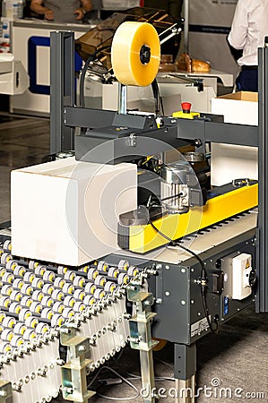 Automatic line for packaging various products on a conveyor Stock Photo