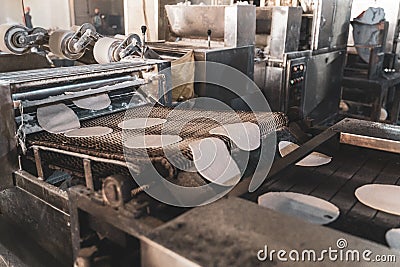 Automatic machine prepare chapati - traditional Indian bread at the Golden Temple sri harmandir sahib in Amritsar Stock Photo