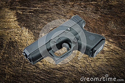 Automatic 9mm. handgun pistol on bark tree background Stock Photo