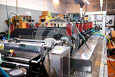 Automatic plastic flat bottom bags making and printing machine in modern factory, plastic packaging is mayor industrial Stock Photo