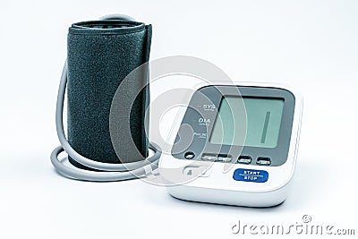 Automatic portable blood pressure machine with arm cuff on white, studio shot. Stock Photo