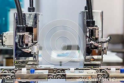 Automatic robot arm with optical sensor working in factory Stock Photo