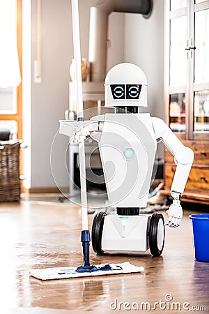 Automatic robot floor scrubber is doing his work Stock Photo