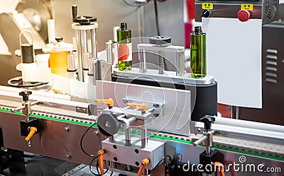 Automatic round bottle labelling machine sticker Stock Photo