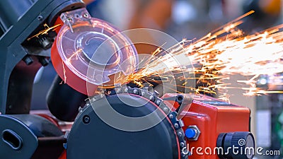 Automatic saw chain sharpening machine during work at workshop - close up Stock Photo
