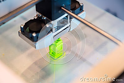 Automatic three dimensional 3d printer performs product creation. Modern 3D printing or additive manufacturing and robotic Stock Photo