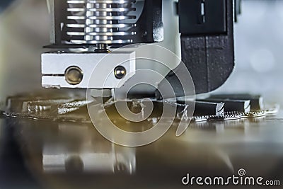 Automatic 3D printer machine printing black flat plastic model: close up Stock Photo