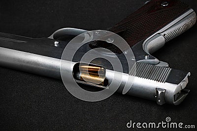 Automatic white gun stainless steel pistol weapon model m1911 with real bullet ammo head in black background Stock Photo