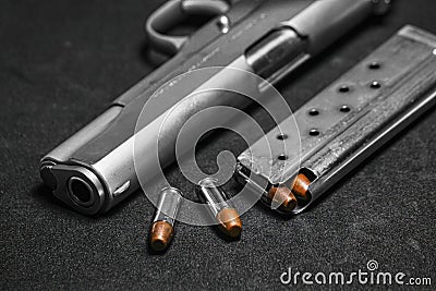 Automatic white gun stainless steel pistol weapon model m1911 with real bullet ammo and magazine with black background Stock Photo