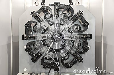 Automatic wire bending machine, High precision CNC machining center working, operator making automotive spring part process in fa Stock Photo