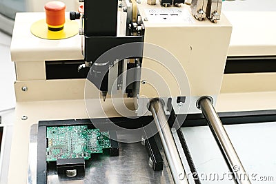 Automation of machine assembly of computer circuit board in the factory for the production of computer components. The Stock Photo
