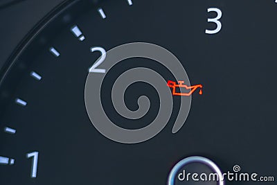 The automobile tachometer has a low oil indicator on it. Close-up Stock Photo