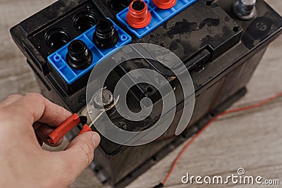 Automotive battery maintenance Stock Photo