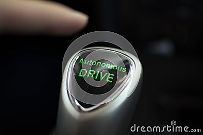 Autonoumous drive button in an electric car Stock Photo