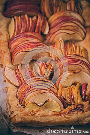 Autumn apple puff pastry tart with cinnamon spice and honey drizzle. Comfort Fall baking food Stock Photo