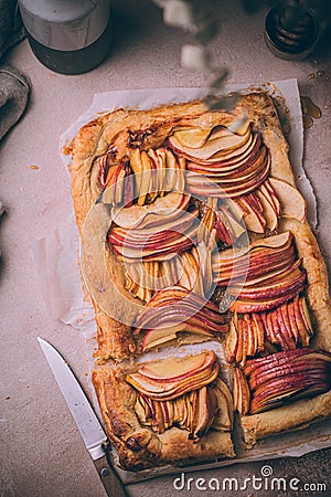 Autumn apple puff pastry tart with cinnamon spice and honey drizzle. Comfort Fall baking food Stock Photo