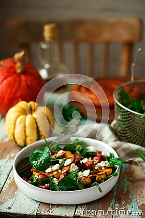 AUTUMN ARUGULA pumpkin chorizo feta salad. Stock Photo