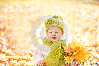 Autumn Baby, Happy Kid Outdoors Portrait with Yellow Fall Leaves Stock Photo