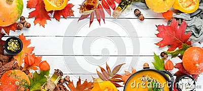 Autumn background with coffee, pumpkin, autumn leaves. flat lay. On a white wooden background. Top view. Stock Photo