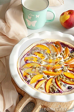 Pie with peach, blueberry and pumpkin seeds Stock Photo