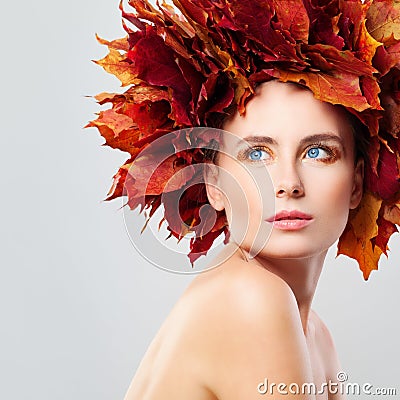 Autumn Beauty. Woman in Wreath of Fall Leaves Stock Photo