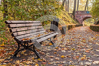 Autumn bench and path to the bridge Stock Photo