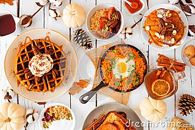 Autumn breakfast or brunch buffet table scene against a white wood background. Top view. Stock Photo