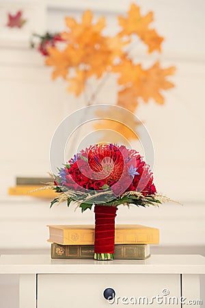 Autumn bridal bouquet of red color with books Stock Photo