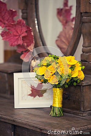 Autumn bridal bouquet from roses on a vintage wooden table Stock Photo