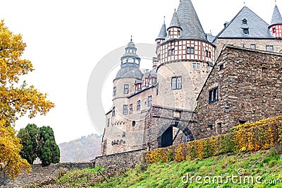 Autumn Burresheim Castle with topiary green trees in ornamental Stock Photo