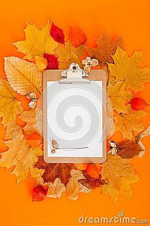 Autumn clipboard mockup with fall leaves Stock Photo