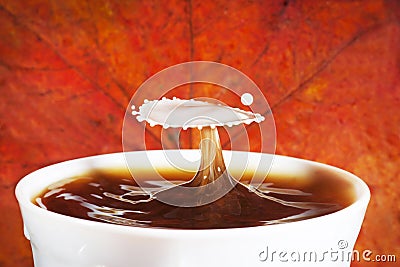 Autumn coffee with splash of milk Stock Photo