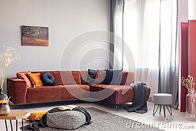 Autumn colored interior of classy living room in modern apartment Stock Photo