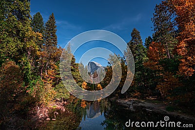 Autumn colors in Yosemite Valley with Half Dome in the center Stock Photo